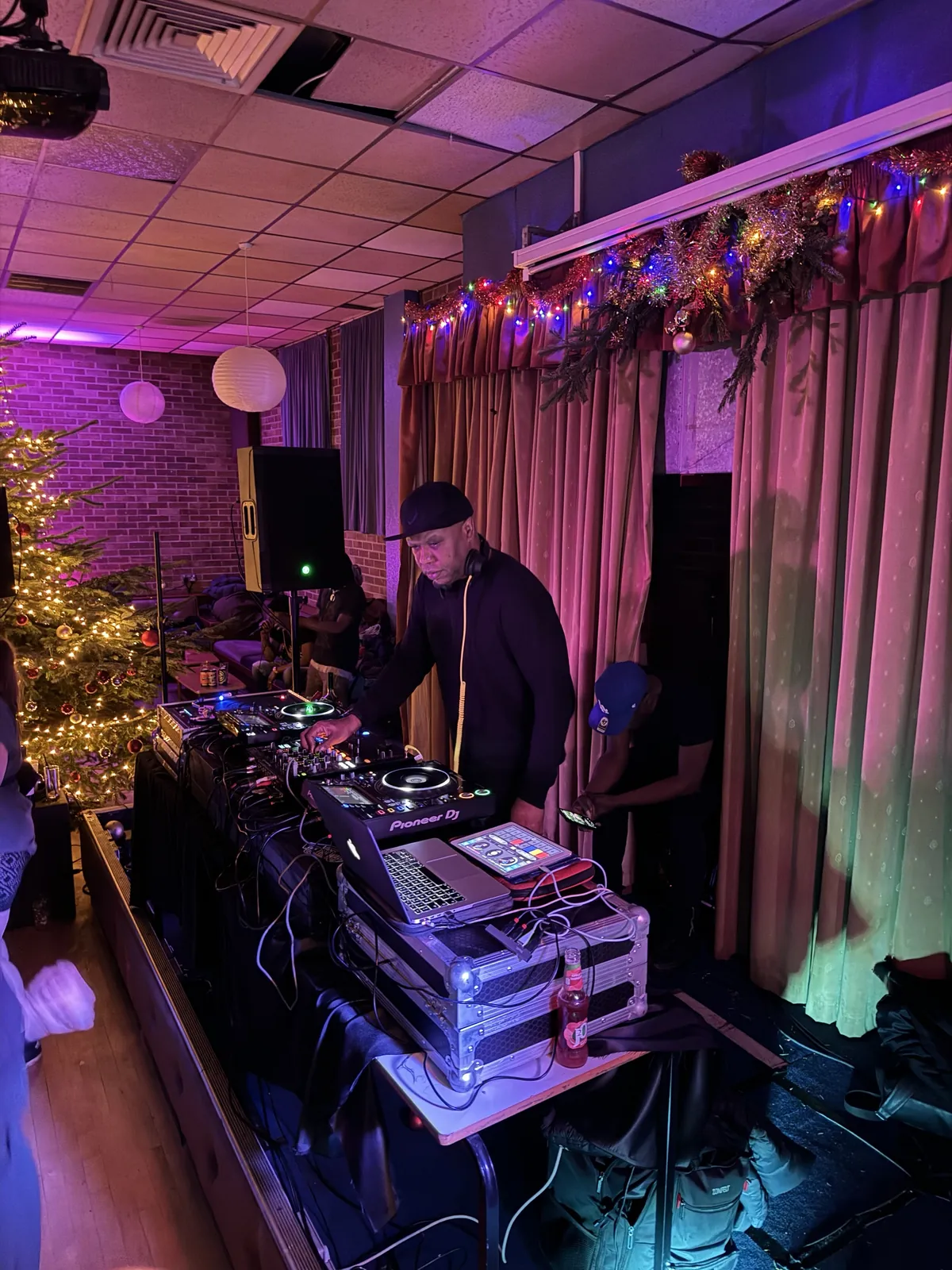 Grooverider DJing on the Scruff Bag Sound System decks at a Christmas party